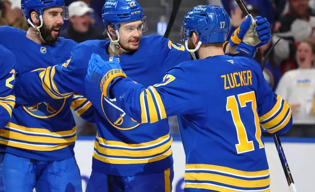 Buffalo Sabres left wing Jason Zucker (17) celebrates his goal with right wing Jack Quinn (22) during the first period in Game 5 of a second-round NHL hockey Stanley Cup playoff series against the Montreal Canadiens, Thursday, May 14, 2026, in Buffalo, N.Y. (AP Photo/Jeffrey T. Barnes)