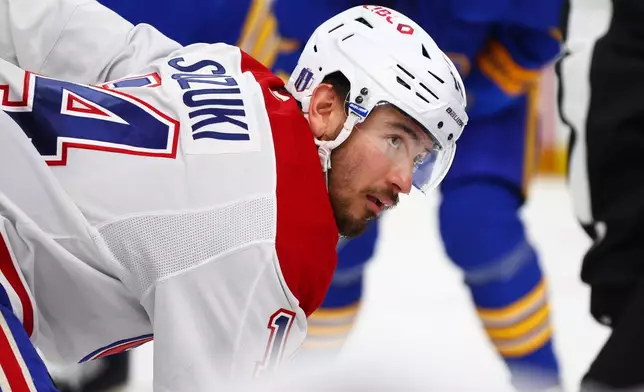 Montreal Canadiens center Nick Suzuki lines up for a face-off during the second period in Game 5 of a second-round NHL hockey Stanley Cup playoff series against the Buffalo Sabres, Thursday, May 14, 2026, in Buffalo, N.Y. (AP Photo/Jeffrey T. Barnes)