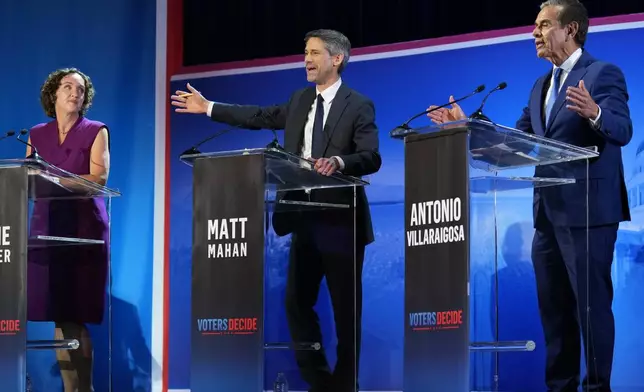 Antonio Villaraigosa, right, and Matt Mahan speak during a California gubernatorial debate hosted by CBS LA at Pomona College in Claremont, Calif., Tuesday, April 28, 2026. (AP Photo/Jae C. Hong)