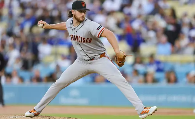 San Francisco Giants starting pitcher Landen Roupp throws during the first inning of a baseball game against the Los Angeles Dodgers, Thursday, May 14, 2026, in Los Angeles. (AP Photo/Ryan Sun)