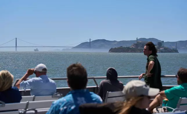 Passengers ride a San Francisco Bay ferry, Tuesday, May 19, 2026. (AP Photo/Annika Hammerschlag)