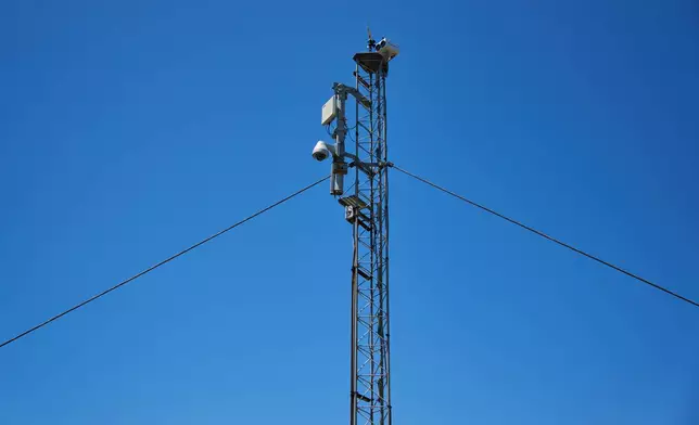 A WhaleSpotter device that scans the bay around the clock for whale blows and heat signatures is mounted on a tower on Angel Island in San Francisco Bay, Tuesday, May 19, 2026. (AP Photo/Annika Hammerschlag)
