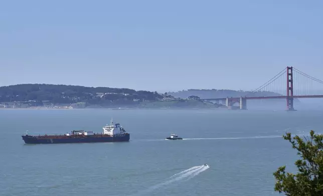 A tanker and other vessels pass through the San Francisco Bay, Tuesday, May 19, 2026. (AP Photo/Annika Hammerschlag)