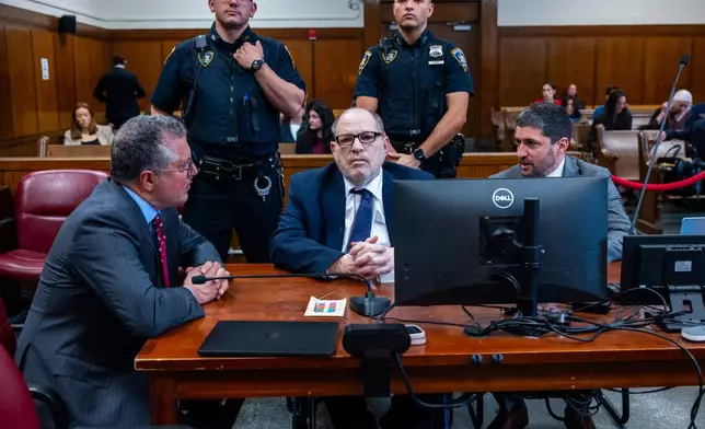 Harvey Weinstein appears with attorneys Marc Agnifilo, left, and Jacob Kaplan in Manhattan criminal court, Thursday, May 14, 2026, in New York. (Spencer Platt/Pool Photo via AP)