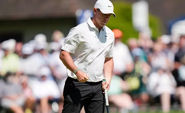 Rory McIlroy, of Northern Ireland, reacts after his shot on the 18th green during the third round of the PGA Championship golf tournament at Aronimink Golf Club, Saturday, May 16, 2026, in Newtown Square, PA. (AP Photo/Frank Franklin II)