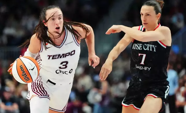 Toronto Tempo's Marina Mabrey (3) drives past Portland Fire's Teja Oblak (7) during the second half of a WNBA basketball game in Toronto, Saturday May 23, 2026. (Frank Gunn/The Canadian Press via AP)