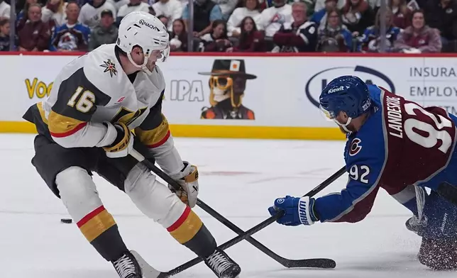 Colorado Avalanche left wing Gabriel Landeskog, right, blocks the shot by Vegas Golden Knights right wing Pavel Dorofeyev during the second period in Game 1 of the Western Conference finals NHL hockey Stanley Cup playoff series Wednesday, May 20, 2026, in Denver. (AP Photo/David Zalubowski)
