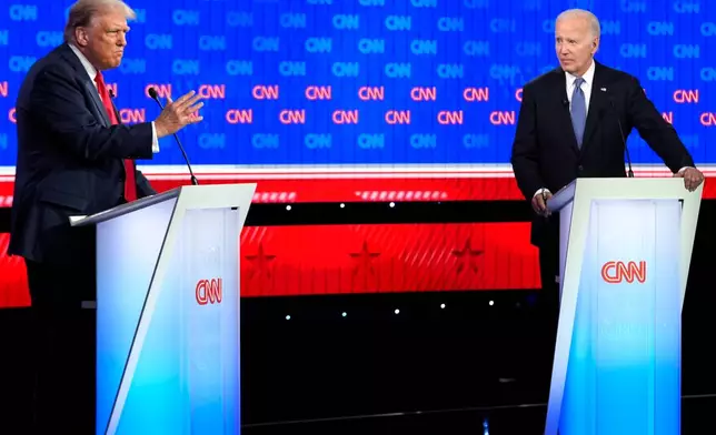 FILE - President Joe Biden, right, and Republican presidential candidate former President Donald Trump, left, participate in a presidential debate hosted by CNN, Thursday, June 27, 2024, in Atlanta. (AP Photo/Gerald Herbert)