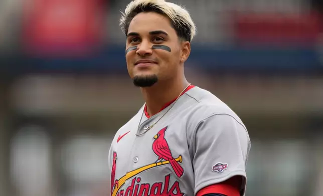 St. Louis Cardinals Bryan Torres, wearing his MLB debut patch, walks from second base during the second inning in the first baseball game of a doubleheader against the Cincinnati Reds in Cincinnati, Saturday, May 23, 2026. (AP Photo/Carolyn Kaster)
