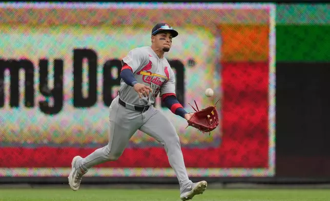 St. Louis Cardinals left fielder Bryan Torres catches a fly ball hit by Cincinnati Reds' JJ Bleday during the sixth inning of the first baseball game of a doubleheader in Cincinnati, Saturday, May 23, 2026. (AP Photo/Carolyn Kaster)