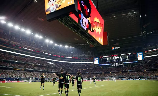 FILE - Mexico's Javier Hernandez (14) celebrates with teammates after scoring a penalty kick during a friendly soccer match against Argentina at the AT&amp;T Stadium in Arlington, Texas, Sept. 8, 2015. (AP Photo/Tony Gutierrez, File)