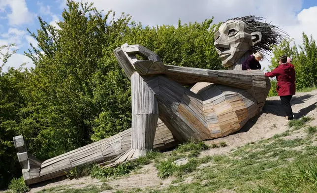 "Hill Top Trine" troll sculpture by Thomas Dambo is seen in Hvidovre, Denmark, May 14, 2026. (AP Photo/James Brooks)
