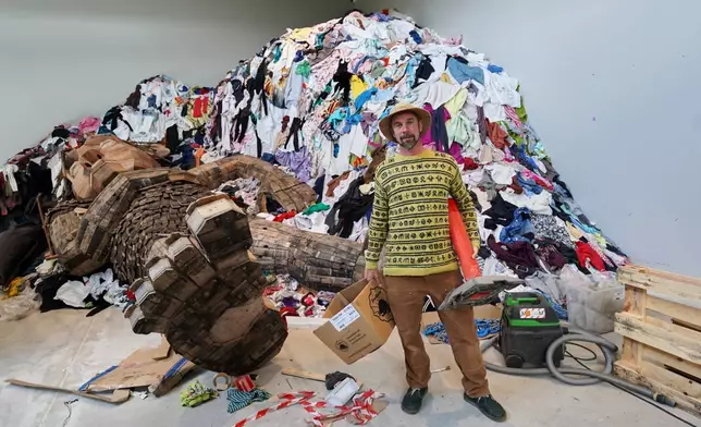 Danish recycling artist Thomas Dambo poses for a photograph in his new exhibit "The Garbage Man" at Arken Museum of Contemporary Art in Ishoj, Denmark, May 14, 2026. (AP Photo/James Brooks)