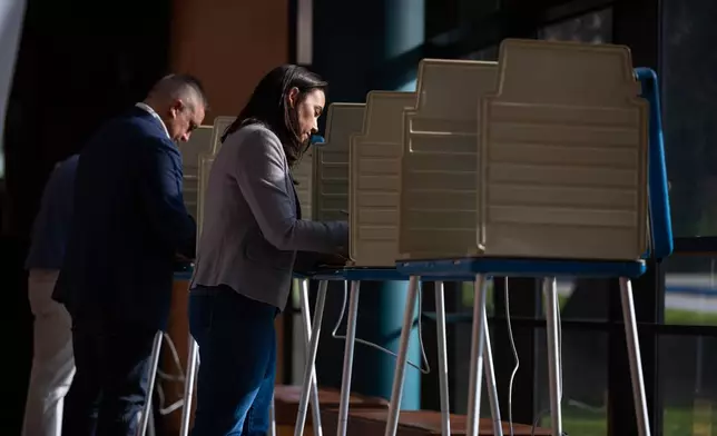 Denise Powell, candidate for the Democratic nomination to the House of Representatives in Nebraska's second district, votes in the Nebraska Primary Election at Omaha Community Playhouse Tuesday, May 12, 2026, in Omaha, Neb. (AP Photo/Rebecca S. Gratz)
