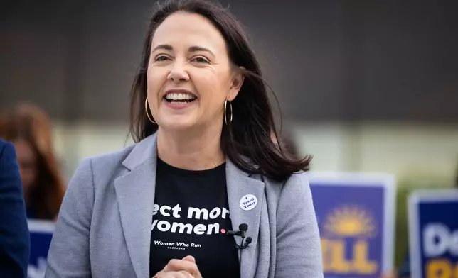 Denise Powell, candidate for the Democratic nomination to the House of Representatives in Nebraska's second district, speaks to the media after casting her ballot in the Nebraska Primary Election at Omaha Community Playhouse Tuesday, May 12, 2026, in Omaha, Neb. (AP Photo/Rebecca S. Gratz)