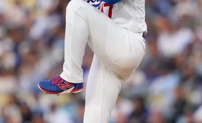 Los Angeles Dodgers pitcher Shohei Ohtani throws to the plate during the first inning of a baseball game against the Colorado Rockies, Wednesday, May 27, 2026, in Los Angeles. (AP Photo/Mark J. Terrill)