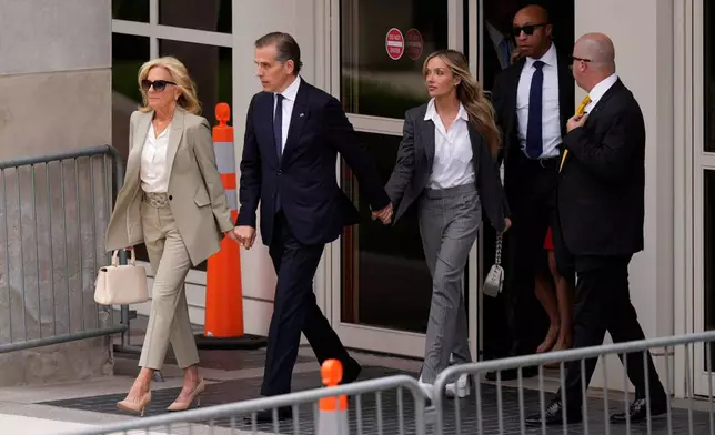 FILE - Hunter Biden, President Joe Biden's son, accompanied by his mother, first lady Jill Biden and his wife, Melissa Cohen Biden, walks out of federal court after hearing the verdict, June 11, 2024, in Wilmington, Del. Hunter Biden has been convicted of all 3 felony charges in the federal gun trial. (AP Photo/Matt Slocum, File)