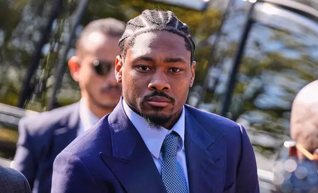 Former New England Patriots wide receiver Stefon Diggs arrives at Norfolk County District Court, Monday, May 4, 2026, in Dedham, Mass. (AP Photo/Charles Krupa)