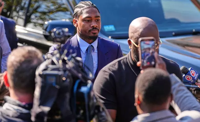 Former New England Patriots wide receiver Stefon Diggs arrives at Norfolk County District Court, Monday, May 4, 2026, in Dedham, Mass. (AP Photo/Charles Krupa)