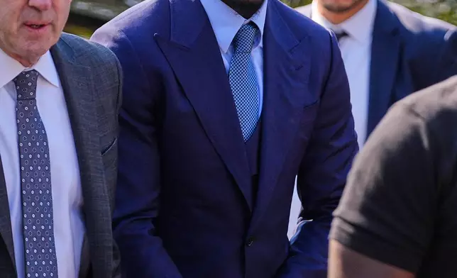 Former New England Patriots wide receiver Stefon Diggs arrives at Norfolk County District Court, Monday, May 4, 2026, in Dedham, Mass. (AP Photo/Charles Krupa)