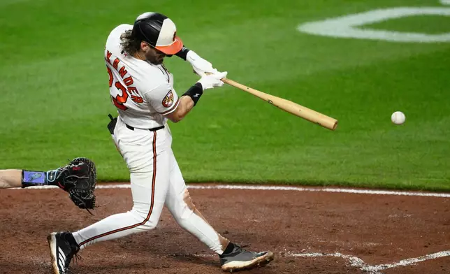Baltimore Orioles' Blaze Alexander hits a double driving in two runs during the fifth inning of a baseball game against the Tampa Bay Rays, Wednesday, May 27, 2026, in Baltimore. (AP Photo/Nick Wass)