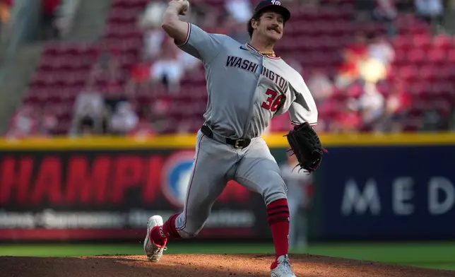 Washington Nationals pitcher Miles Mikolas delivers a pitch during the first inning of a baseball game against the Cincinnati Reds, Tuesday, May 12, 2026, in Cincinnati. (AP Photo/Kareem Elgazzar)