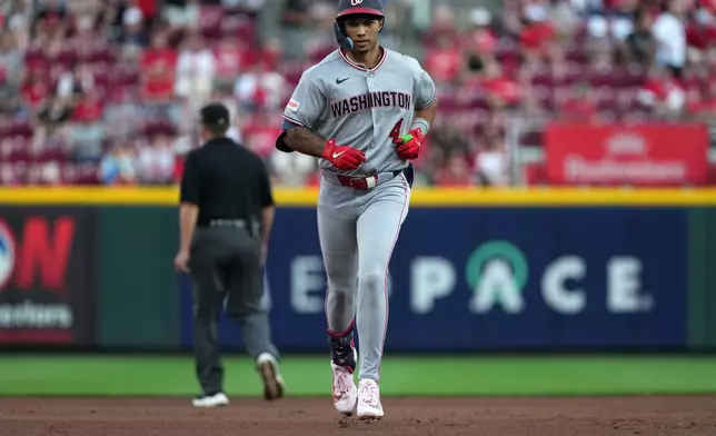 Washington Nationals' Daylen Lile rounds the bases after hitting a solo home run during the fourth inning of a baseball game against the Cincinnati Reds, Tuesday, May 12, 2026, in Cincinnati. (AP Photo/Kareem Elgazzar)