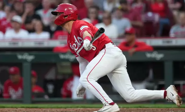 Cincinnati Reds' second baseman Matt McLain grounds into a fielder's choice that scores teammate Elly de la Cruz during the fourth inning of a baseball game against the Washington Nationals, Tuesday, May 12, 2026, in Cincinnati. (AP Photo/Kareem Elgazzar)