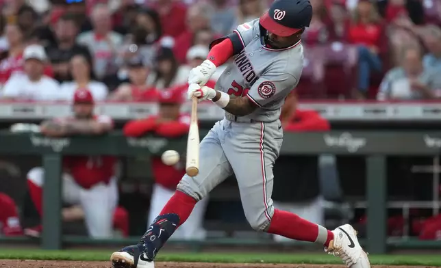 Washington Nationals' Nasim Nuñez hits a single during the fourth inning of a baseball game against the Cincinnati Reds', Tuesday, May 12, 2026, in Cincinnati. (AP Photo/Kareem Elgazzar)