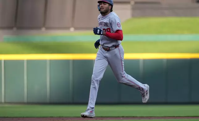 Washington Nationals' James Wood rounds the bases after hitting a solo home run during the third inning of a baseball game against the Cincinnati Reds, Tuesday, May 12, 2026, in Cincinnati. (AP Photo/Kareem Elgazzar)