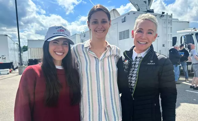 From left, NBC Sports on-air reporter Britney Eurton, producer Lindsay Schanzer and retired jockey-turned-reporter Donna Brothers pose for a photo at Churchill Downs in Louisville, Ky., Wednesday, April 29, 2026. (AP Photo/Stephen Whyno)