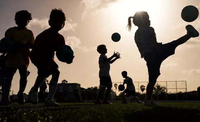 Children train at the C-Stars United soccer academy in Willemstad, Curacao, Friday, May 15, 2026. (AP Photo/Matias Delacroix)