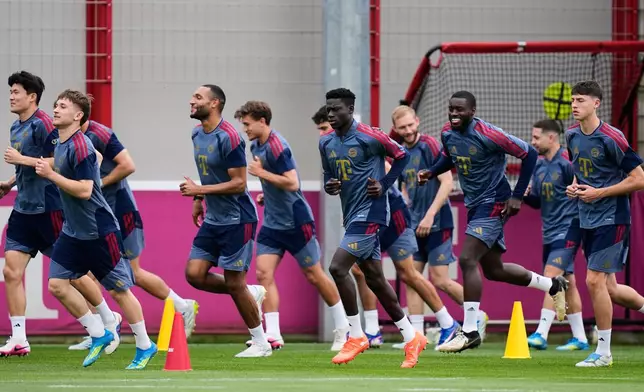 Munich players attend a training session in Munich, Germany, Tuesday, May 5, 2026, ahead of the Champions League semifinal second leg soccer match between FC Bayern and PSG. (AP Photo/Matthias Schrader)