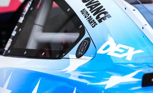 A decal is displayed on Denny Hamlin's car in honor of late driver Kyle Busch prior to a NASCAR Cup Series auto race, Sunday, May 24, 2026, in Charlotte, N.C. (AP Photo/Matt Kelley)