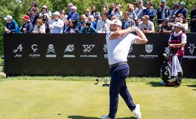 Captain Jon Rahm of Legion XIII hits his shot from the first tee during the first round of the LIV Golf tournament at Trump National Golf Club, Thursday, May 7, 2026 in Sterling, Va. (Pedro Salado/LIV Golf via AP)