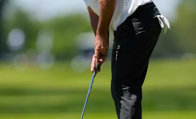 Scottie Scheffler putts on the third green during a PGA Championship golf tournament practice round at Aronimink Golf Club, Tuesday, May 12, 2026, in Newtown Square, PA. (AP Photo/Carolyn Kaster)