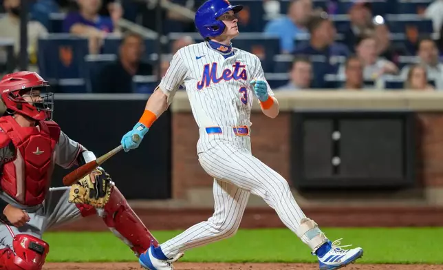 New York Mets' Carson Benge (3) hits an RBI single during the seventh inning of a baseball game against the Cincinnati Reds, Wednesday, May 27, 2026, in New York. (AP Photo/Yuki Iwamura)