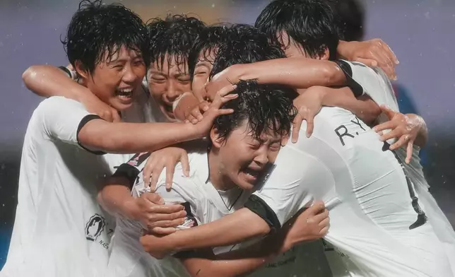 North Korea's Naegohyang Women's FC, Kim Kyong Yong, centre, is congratulated by teammates after scoring her team's second goal during the AFC Women's Champions League semifinal match against South Korea's Suwon FC in Suwon, South Korea, Wednesday, May 20, 2026. (AP Photo/Lee Jin-man)