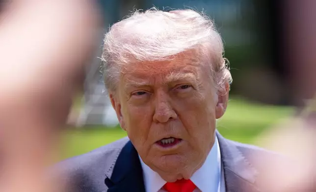 President Donald Trump speaks with reporters before departing on Marine One from the South Lawn of the White House, Friday, May 1, 2026, in Washington. (AP Photo/Alex Brandon)