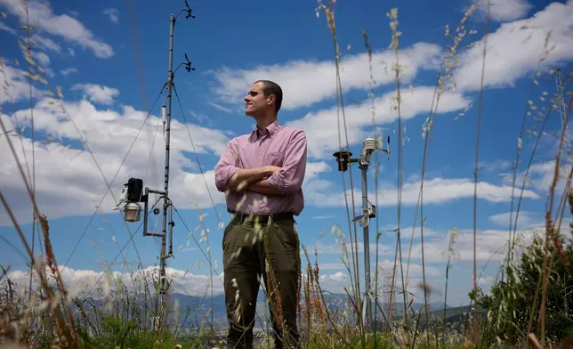 Snow hydrologist Konstantis Alexopoulos poses on Mount Penteli, in Athens, on May 20, 2026. (AP Photo/Thanassis Stavrakis)