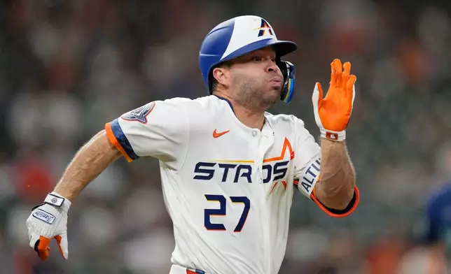 Houston Astros' Jose Altuve runs out a ground out against the Seattle Mariners during the seventh inning of a baseball game Monday, May 11, 2026, in Houston. (AP Photo/David J. Phillip)