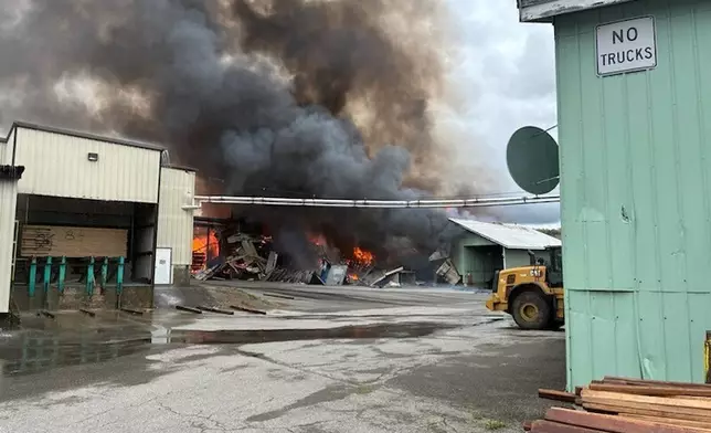 This photo provided by the Maine Department of Public Safety shows flames from a large fire at Robbins Lumber in Searsmont, Maine on Friday, May 15, 2026 (Maine Department of Public Safety via AP)