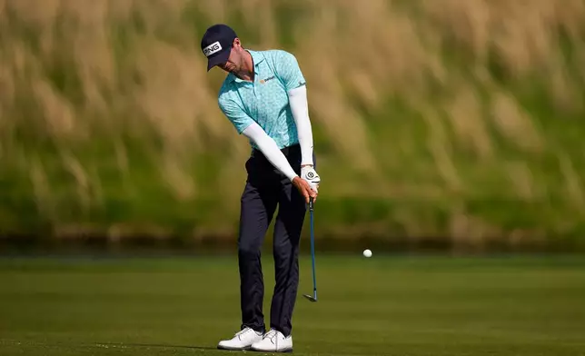 Alex Smalley hits on the eighth hole during the third round of the PGA Championship golf tournament at Aronimink Golf Club, Saturday, May 16, 2026, in Newtown Square, PA. (AP Photo/Matt Slocum)