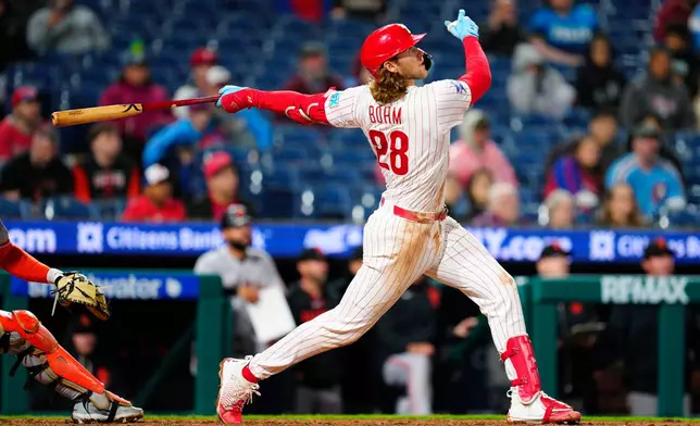 Philadelphia Phillies' Alec Bohm watches wal-off sacrifice fly during the 10th inning of the second baseball game of a doubleheader against the San Francisco Giants, Thursday, April 30, 2026, in Philadelphia. (AP Photo/Derik Hamilton)
