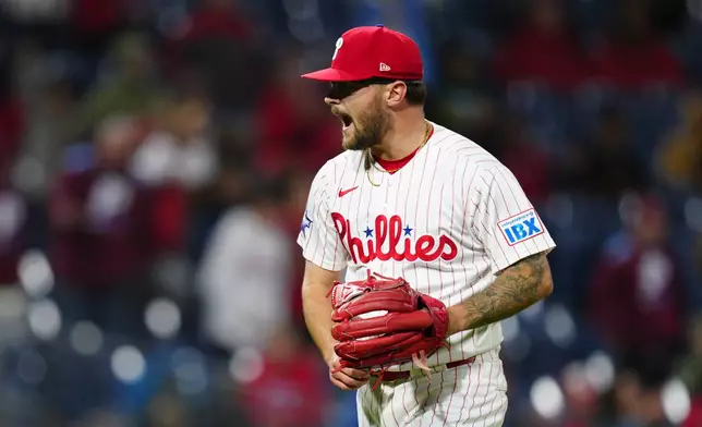 Philadelphia Phillies pitcher Chase Shugart reacts after a fly out by San Francisco Giants' Casey Schmitt during the 10th inning of the second baseball game of a doubleheader, Thursday, April 30, 2026, in Philadelphia. (AP Photo/Derik Hamilton)