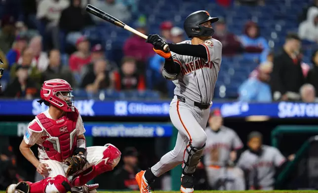 San Francisco Giants' Jung Hoo Lee watches his RBI single off Philadelphia Phillies pitcher José Alvarado during the ninth inning of the second baseball game of a doubleheader, Thursday, April 30, 2026, in Philadelphia. (AP Photo/Derik Hamilton)