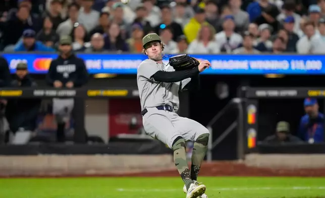 New York Yankees starting pitcher Cam Schlittler throws out New York Mets' Mark Vientos at first base during the fourth inning of a baseball game, Friday, May 15, 2026, in New York. (AP Photo/Yuki Iwamura)