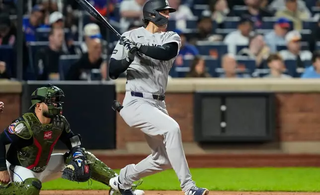 New York Yankees designated hitter Spencer Jones hits an RBI single during the fifth inning of a baseball game against the New York Mets, Friday, May 15, 2026, in New York. (AP Photo/Yuki Iwamura)