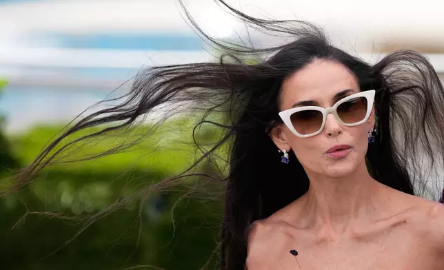 Jury member Demi Moore poses for photographers at the jury photo call at the 79th international film festival, Cannes, southern France, Tuesday, May 12, 2026. (AP Photo/John Locher)