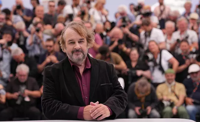 Peter Jackson, recipient of the honorary Palme d'Or, poses for photographers during a photo call at the 79th international film festival, Cannes, southern France, Tuesday, May 12, 2026. (AP Photo/Andreea Alexandru)